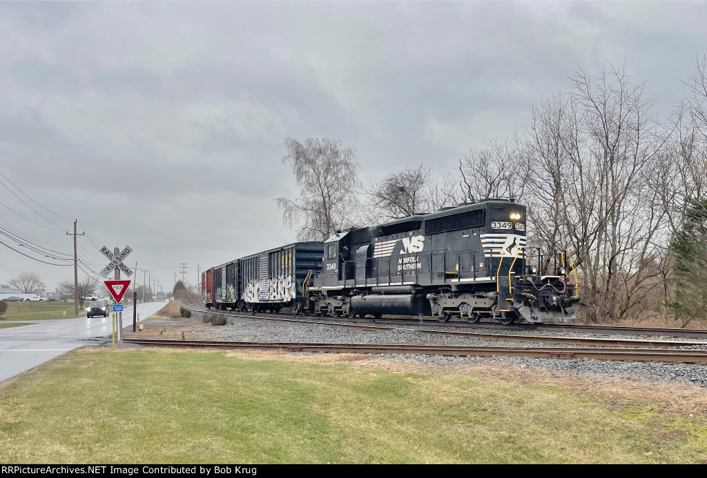 NS train symbol H75 heading west after picking up three empty box cars at Weyerhaeuser